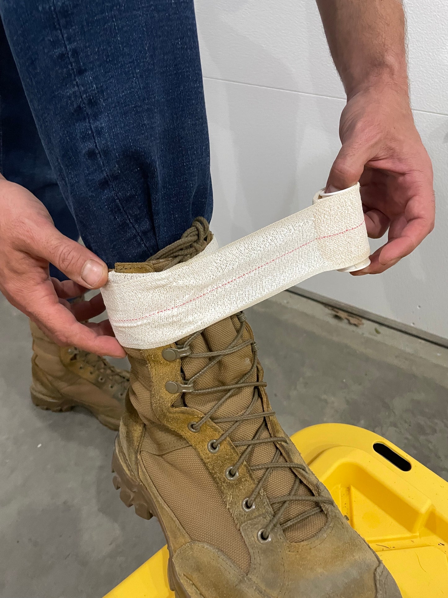 Tick Tape Wrap being applied above the ankle